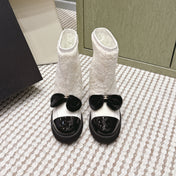 CHANEL 25S ANKLE BOOTS IN WHITE SHEARLING LAMBSKIN AND BLACK PATENT CALFSKIN