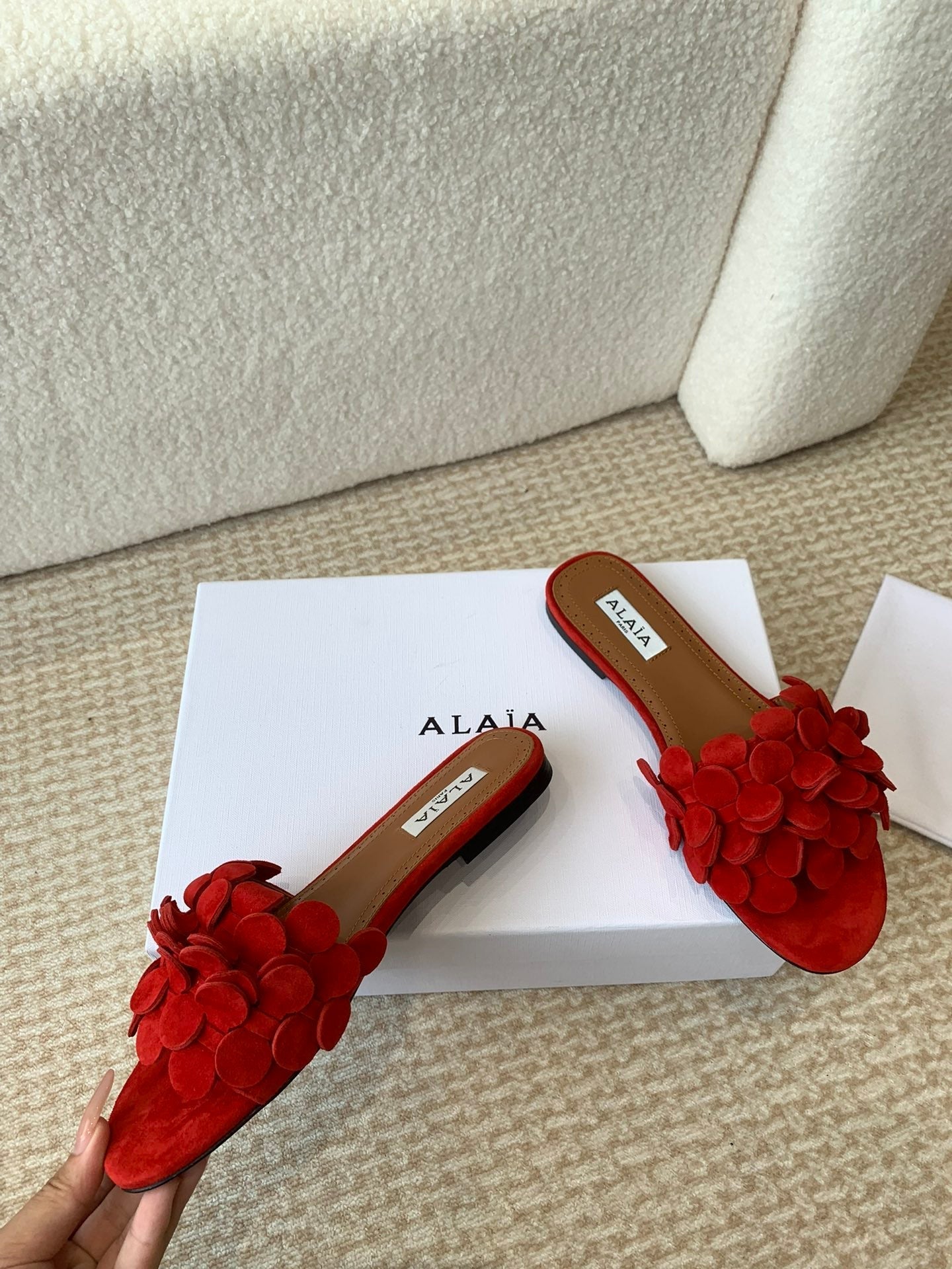 ALAIA FLAT MULE IN CHERRY RED SUEDE