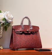 KELLY SELLIER 25 BAG IN BERRY RED OSTRICH LEATHER WITH GOLD HARDWARE