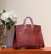 KELLY SELLIER 25 BAG IN BERRY RED OSTRICH LEATHER WITH GOLD HARDWARE