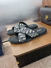 DIOR 25S ALIAS CROSS-STRAP SLIDES IN BLACK CALFSKIN WITH CD OBLIQUE DEEP BLUE LOGO
