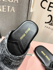 KNITTED MULES IN BLACK MIX WHITE WOOL