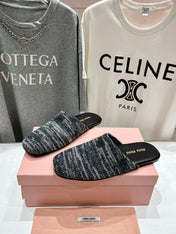 KNITTED MULES IN BLACK MIX WHITE WOOL