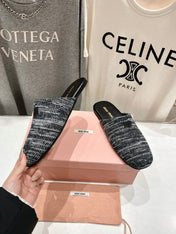 KNITTED MULES IN BLACK MIX WHITE WOOL